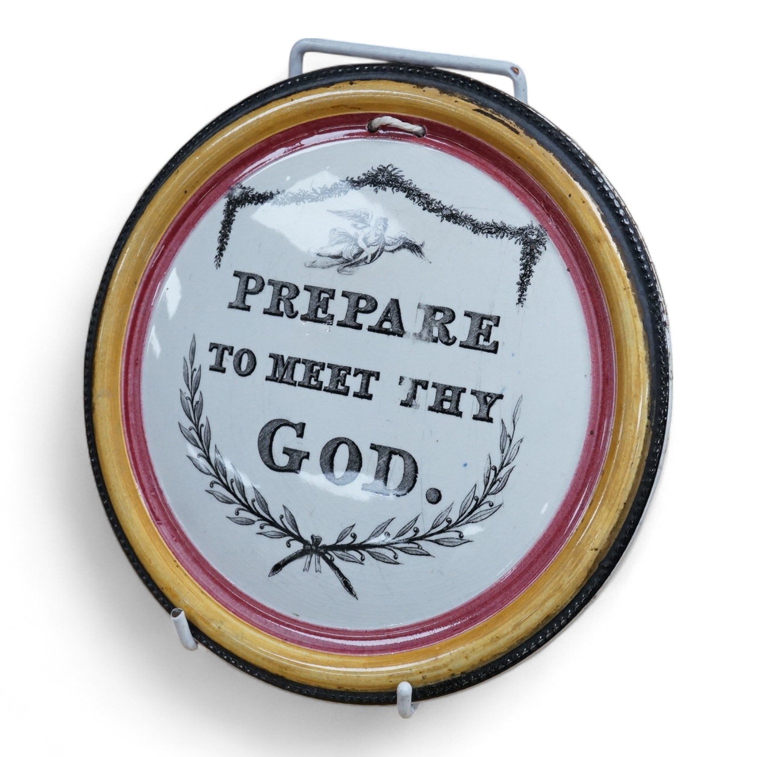 A 19th century pottery plaque ‘Prepare to Meet Thy God’, 19cm in diameter